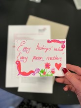 Postcard reading "Every feeling's valued, every person matters"