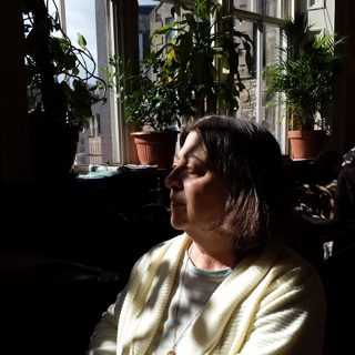 Pat sitting by a window