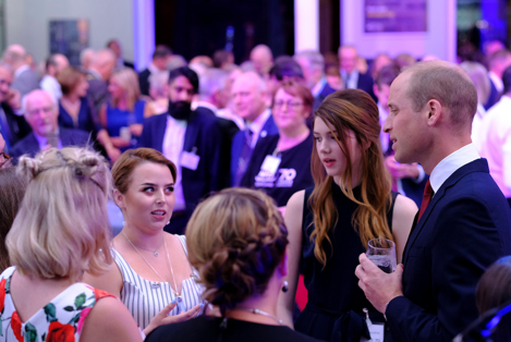 A photograph of See Me volunteer Kristi chatting with Prince William at an event