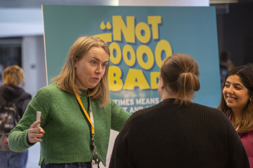 Image is of See Me staff member speaking to a volunteer.